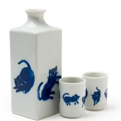 Midnight blue cat sake set featuring playful cats made in Japan available at Miya.
